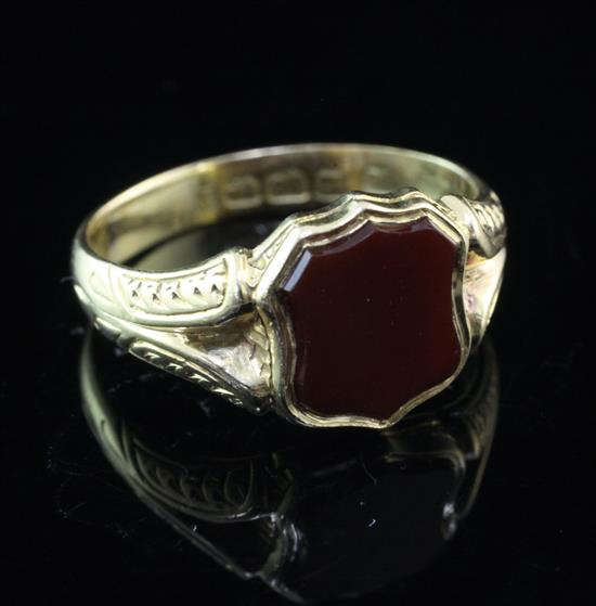 A late Victorian 18ct gold and carnelian set signet ring, size P.